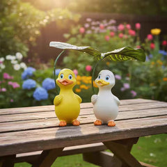 Duck holding a umbrella