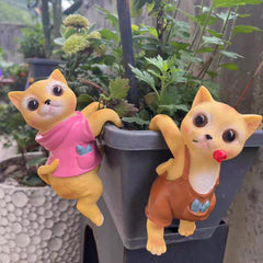 A PAIR OF CATS CLIMBING