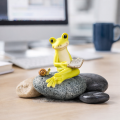 Frog figurine with snail