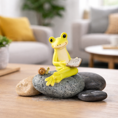 Frog figurine with snail