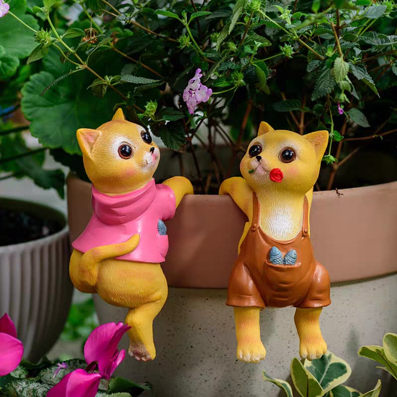 A PAIR OF CATS CLIMBING