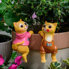 A PAIR OF CATS CLIMBING