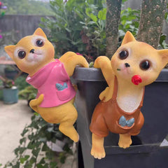 A PAIR OF CATS CLIMBING